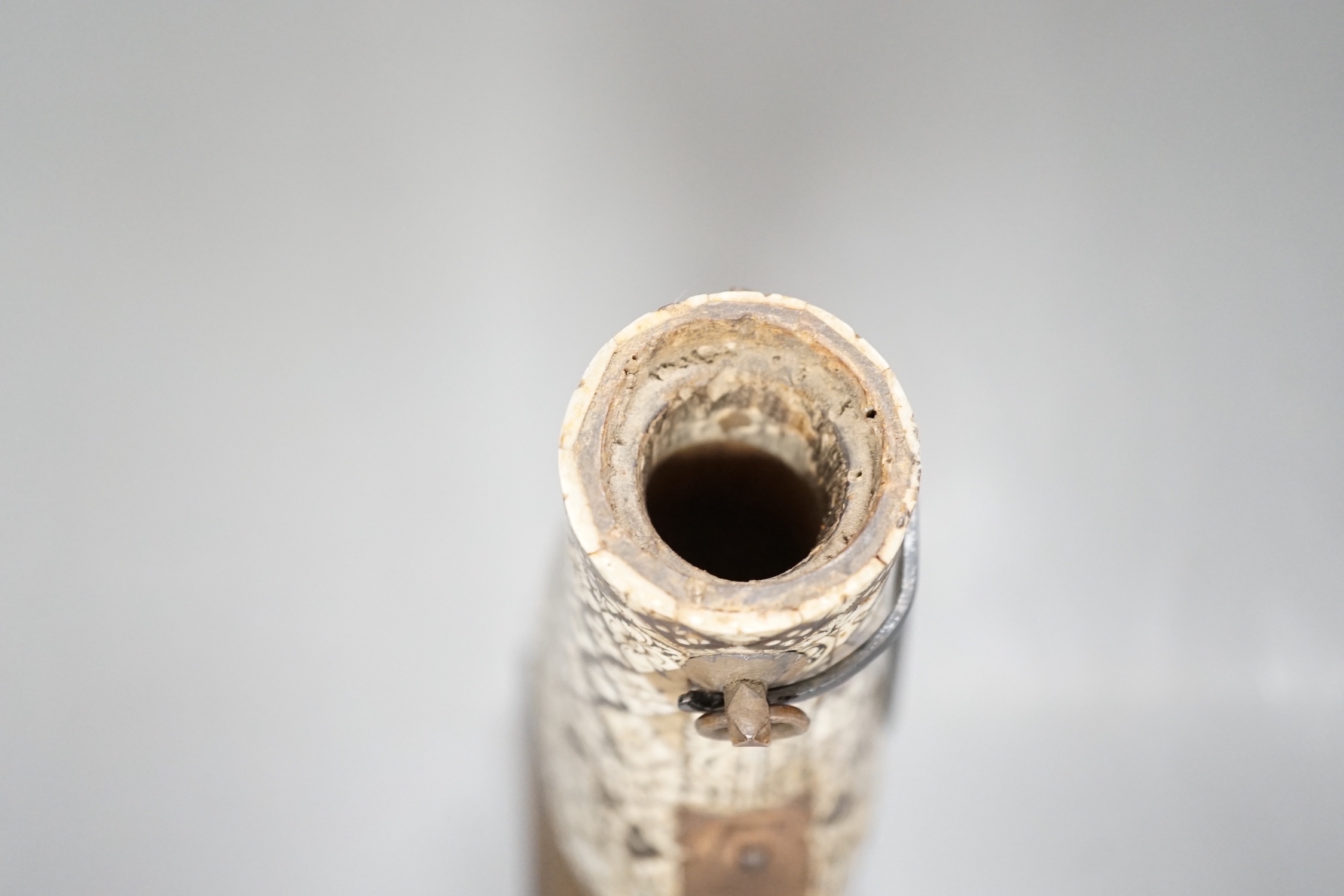 A powder flask, Etawah, India, 19th century, Mother-of-pearl, ivory, horn and black lac on wood - 17cm